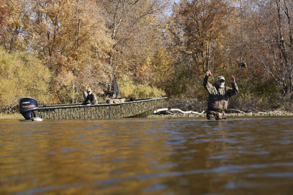 Hunting ducks in a boat